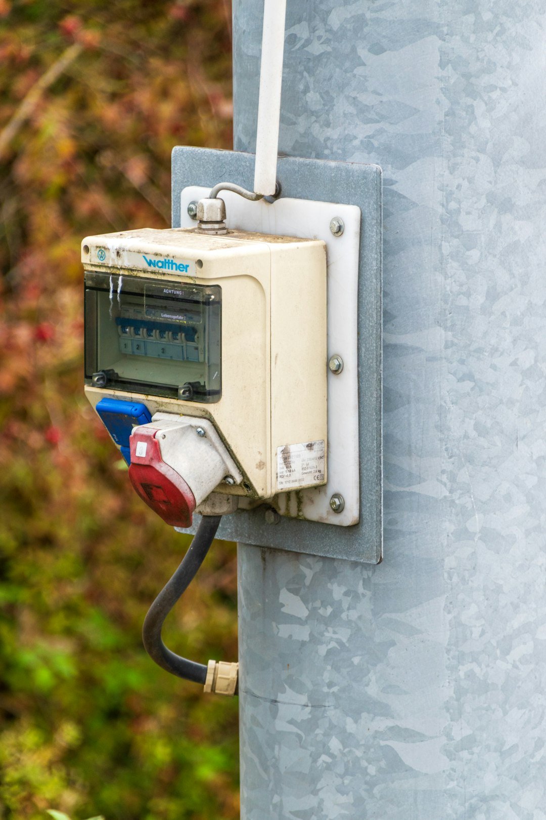 Services electrical-box-with-plugs-attached-to-metal-pole-hev-tfphqa